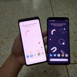 照片将Google Pixel 4 XL放在黑色和白色并排，珊瑚显示在视频上